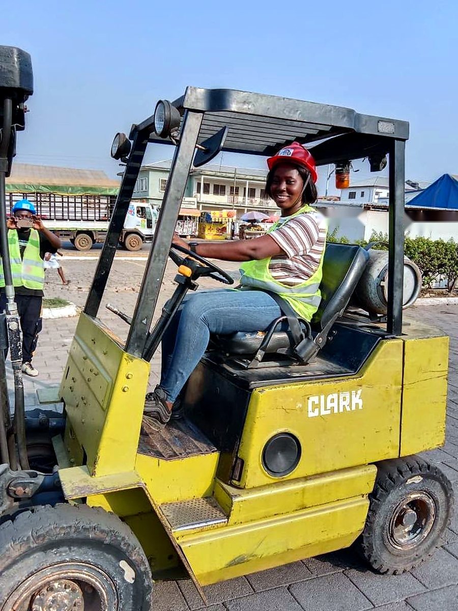 Student practising on a training forklift