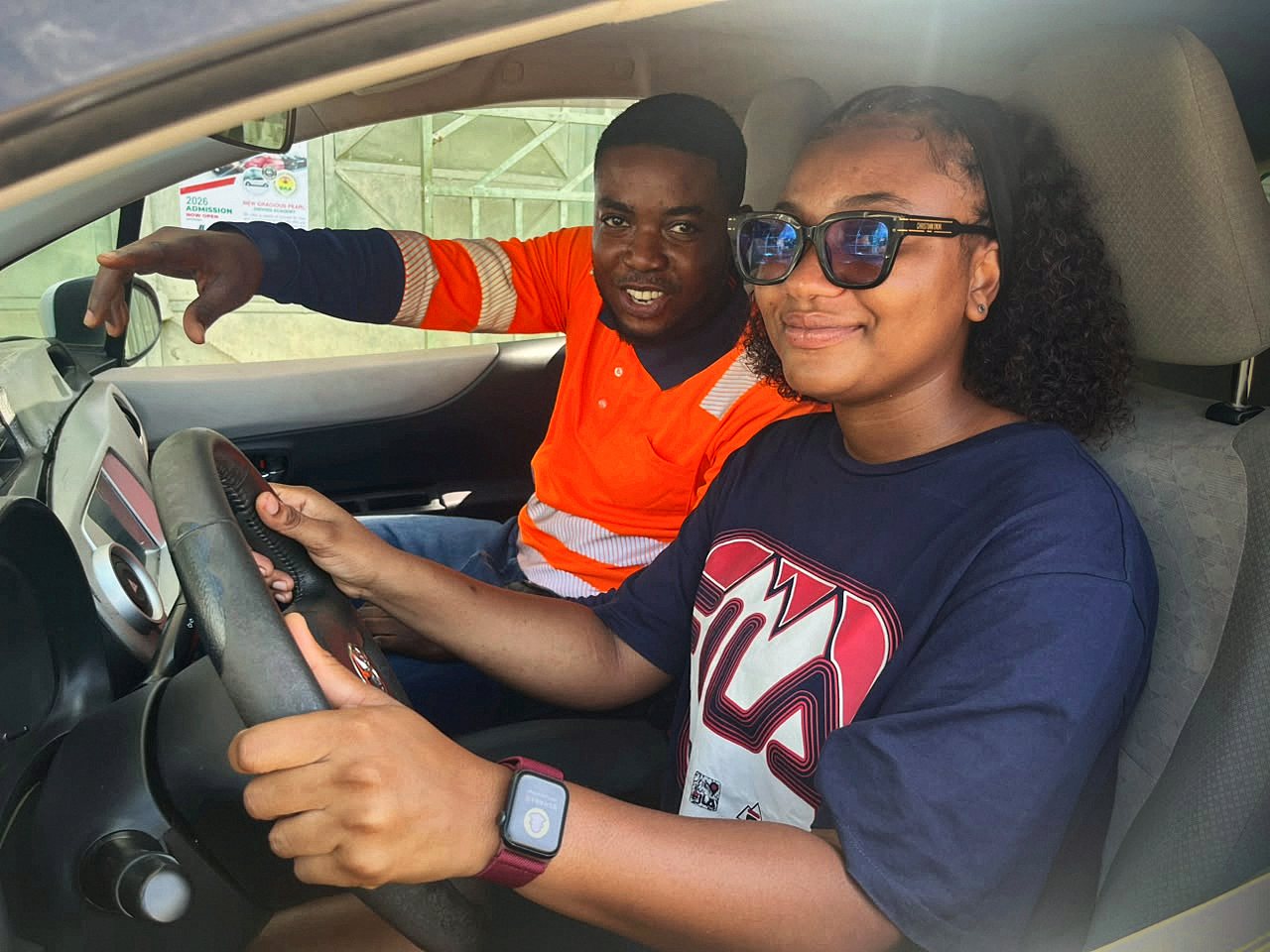Student at the wheel while the instructor gives directions