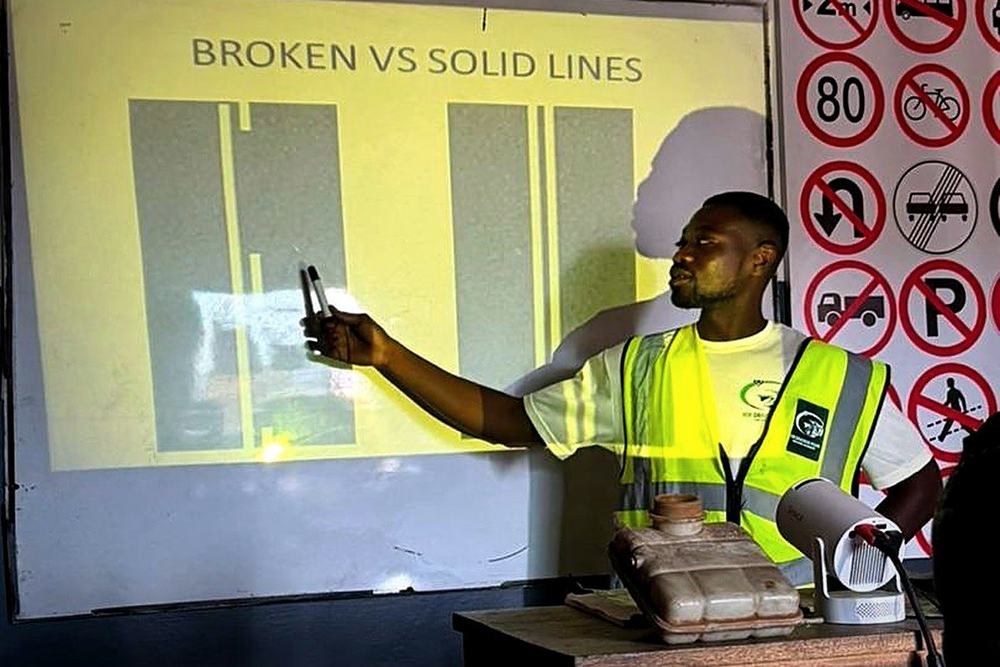 Instructor teaching broken and solid road lines in class